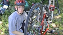 Oliver adjusts his rear brakes at Ryfylkeveien 90, on the banks of Storavatnet, 18.9 miles into the ride